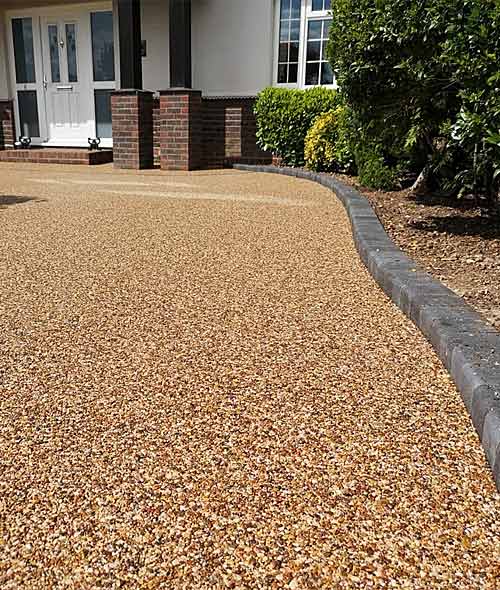 Close view of golden resin beside dark stone edging