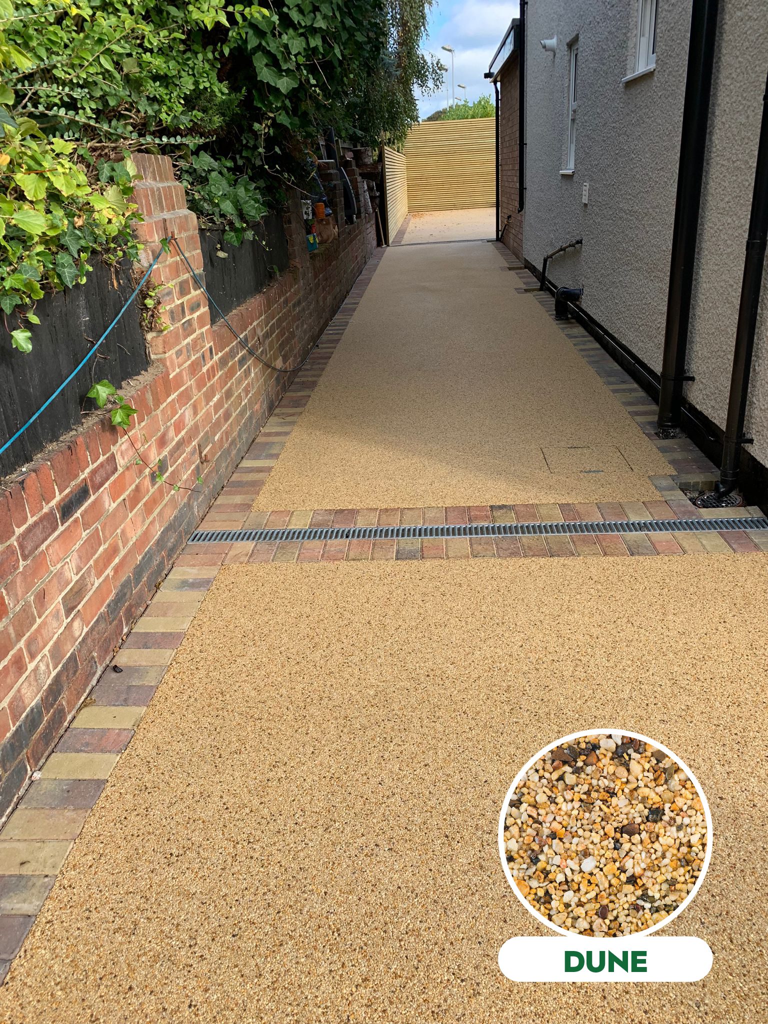 Golden resin pathway finished with decorative brick edging
