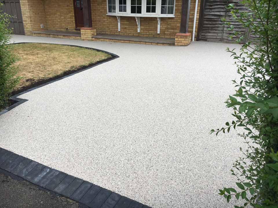 Light resin surface framed by a crisp dark border