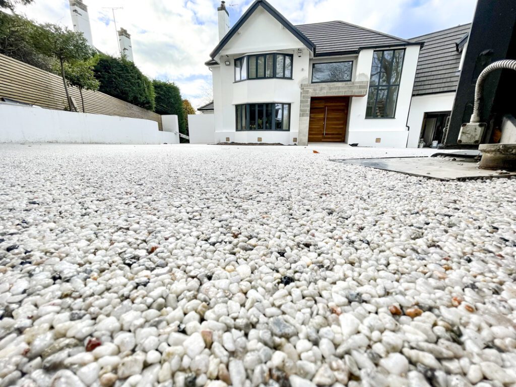 Close-up of a light natural aggregate driveway surface