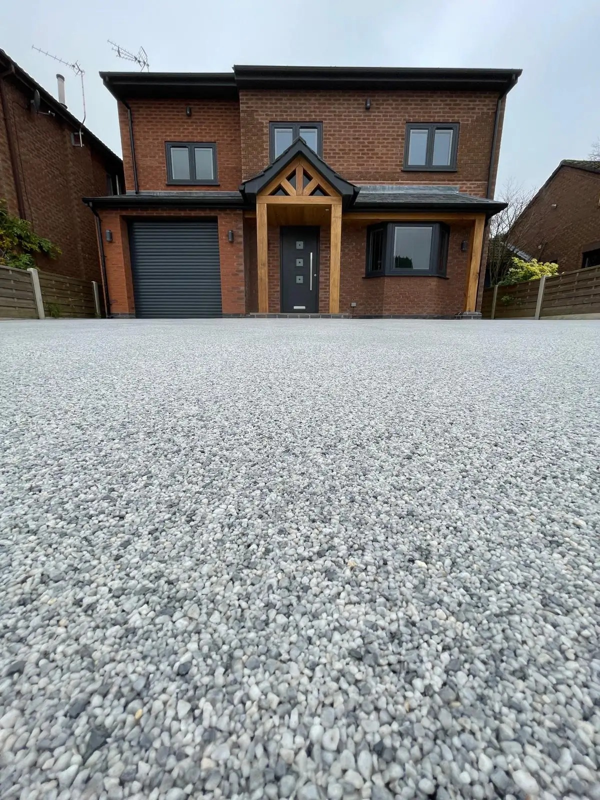 Close-up of an even silver-grey aggregate driveway finish