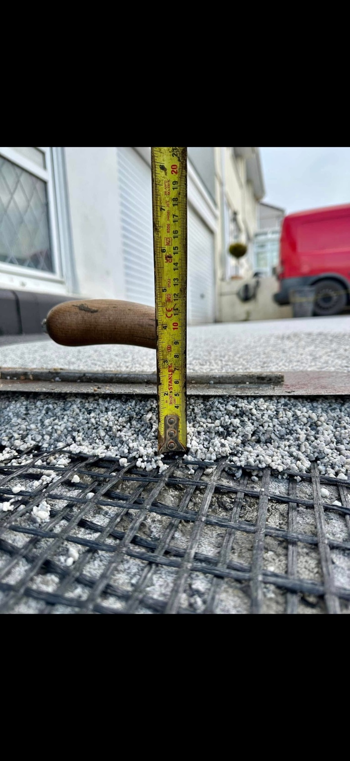 A JD Resin Solutions depth check during a grey resin surface installation