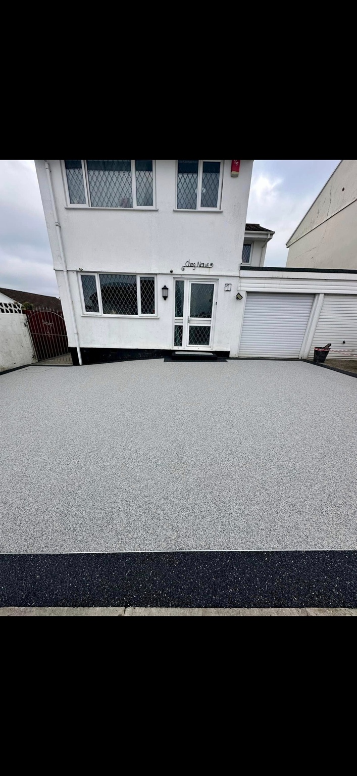 A completed light grey resin driveway installed by JD Resin Solutions